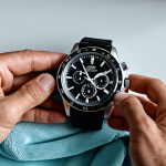 Sports Watch Maintenance**

A person carefully cleaning a sports watch with a soft cloth, fully clothed, in a well-lit, modern home setting. Focus on the detail of the watch face and band. safe for work, appropriate content, professional image, perfect anatomy, correct proportions, natural pose, well-formed hands, proper finger count, modest clothing, family-friendly.

**
