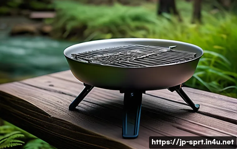캠핑용 이동식 화로 추천 - A lightweight portable hibachi grill designed for camping, featuring a compact aluminum body with fo...